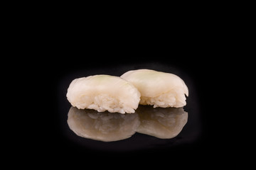 Simple sushi nigiri maki set isolated on black background. Various selection of traditional japanese