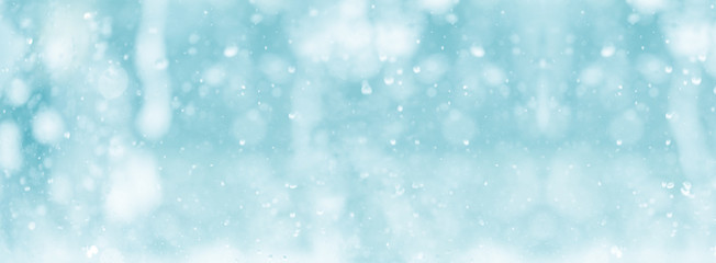 blue color tone of close up rain water drop falling to the floor in rainy season	