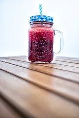 Vitamin jar glass on a woden table 