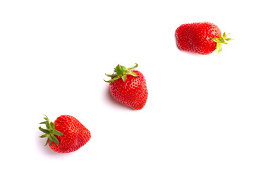 Fototapeta na wymiar Juicy and beautiful strawberries on isolated white background