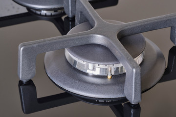 New graphite gas stove burner with reflections. Macro Image