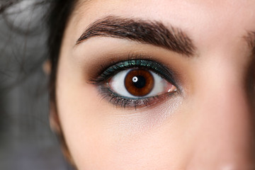 Obraz premium Attractive millennial female right dark brown eye