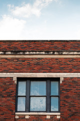 
Historic red brick building facade in Downtown McKinney, Texas, a suburb of Dallas, Texas.