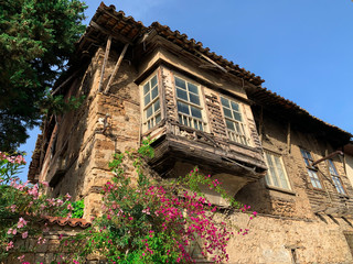 Fototapeta na wymiar A facade of an old historical abandoned building in Antalya Old town Kaleici, Turkey. Ottoman time architecture. Horizontal stock image.