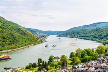 Fototapeta na wymiar Bacharach am Rhein. Beautiful aerial panoramic Postcard view on Middle Rhine River, (Rhein Fluss, Mittelrhein) with ships. Rhineland-Palatinate (Rheinland-Pfalz), Germany UNESCO