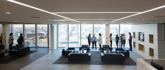 Business people talking in modern business lounge