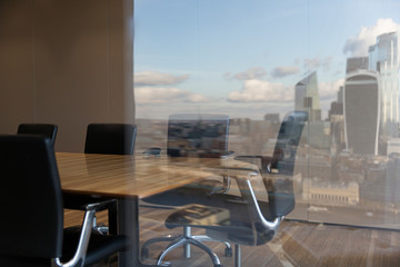 City reflection in conference room window