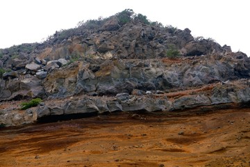 Grey rock on orange ground