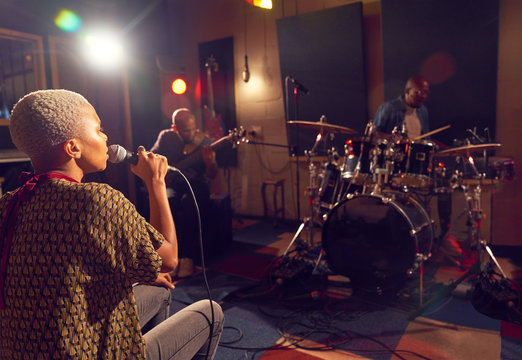Musicians performing in recording studio