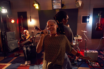 Happy musicians performing on stage