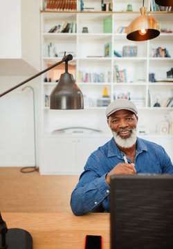 Portrait confident, smiling man working in home office