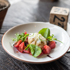 Burrata Cheese with Tomatoes and Basil Leaves