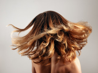 Girl tosses hair in motion blur