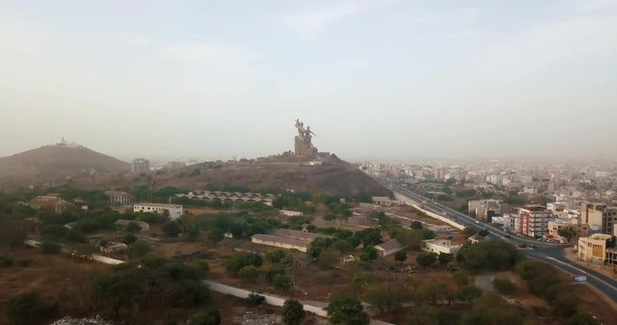 a huge monument on Africa's independence mountain with a view of the city photographed from the throne