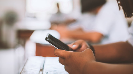 Students Using Smartphones During the Lecture in the classroom.