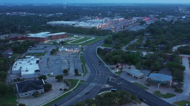Curving City Street with Businesses and Traffic, Bryan, Texas, USA