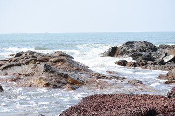 Sea waves hitting the rocks.