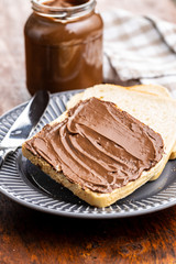 Toast bread with hazelnut spread. Sweet chocolate cream.