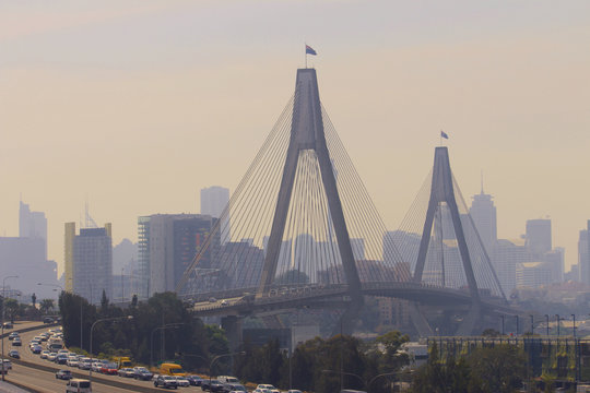 Sydney cityscape showing bush fire haze over the Anzac bridge and city buildings
