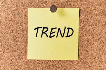 TREND - word written on a sticker sheet of paper or notes on corkwood (cork tree) panel board. Business concept.