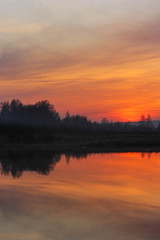 the sun sets over the horizon, the sun's rays.landscape at sunset