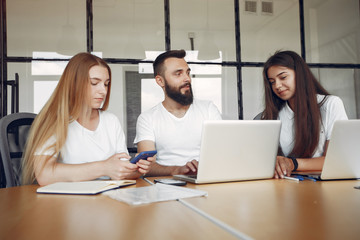 Students create a new project. Team working in a office