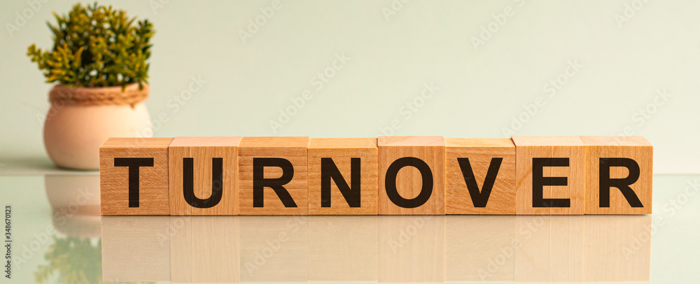 Fototapete word turnover is made of wooden building blocks lying on the table and on a light grey background. c