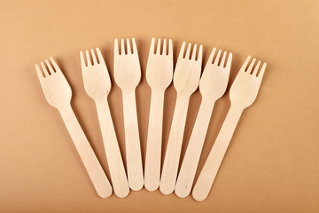 Disposable tableware made of environmental materials. Eco-friendly cookware, zero waste production from recycled materials. Paper plates, glasses, cocktail tubes. Wooden forks and knives. 