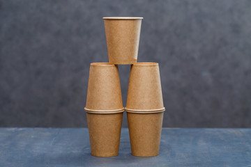 Paper cups for drinking, dishes. Disposable cardboard dishes made from environmentally friendly materials. Doesn't clog nature Eco-friendly, disposable, reusable, compostable dishes.
