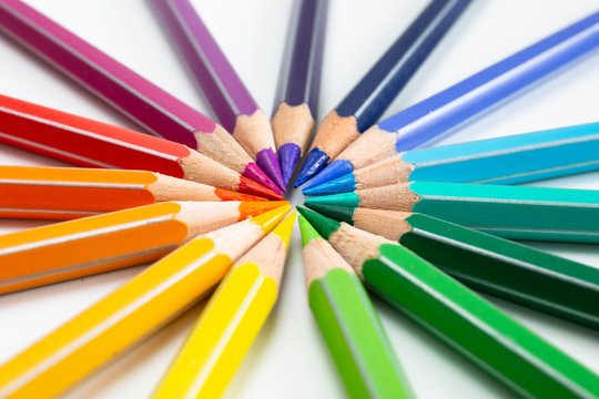 Colored pencils isolated on white. Macro still-file picture made in studio with softbox.