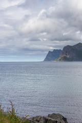 End of fjord. Beautiful Norwegian landscape. view of the fjords. Norway ideal fjord reflection in clear water In cloudy weather. selective focus