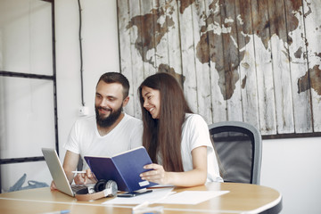 Students create a new project. Couple working in a office