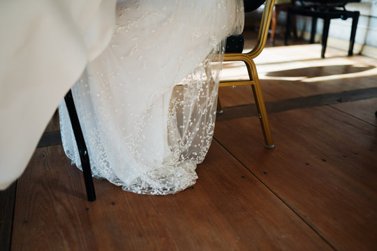 photo of a bride sitting on a chair