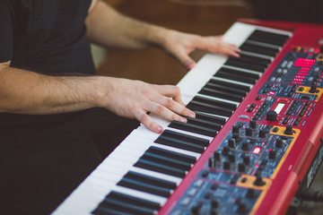man hands touching red keyboard