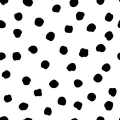 Vector seamless polka dots pattern in a chaotic manner. Hand drawn, doodle style. Design for fabric, wrapping, wallpaper, textile