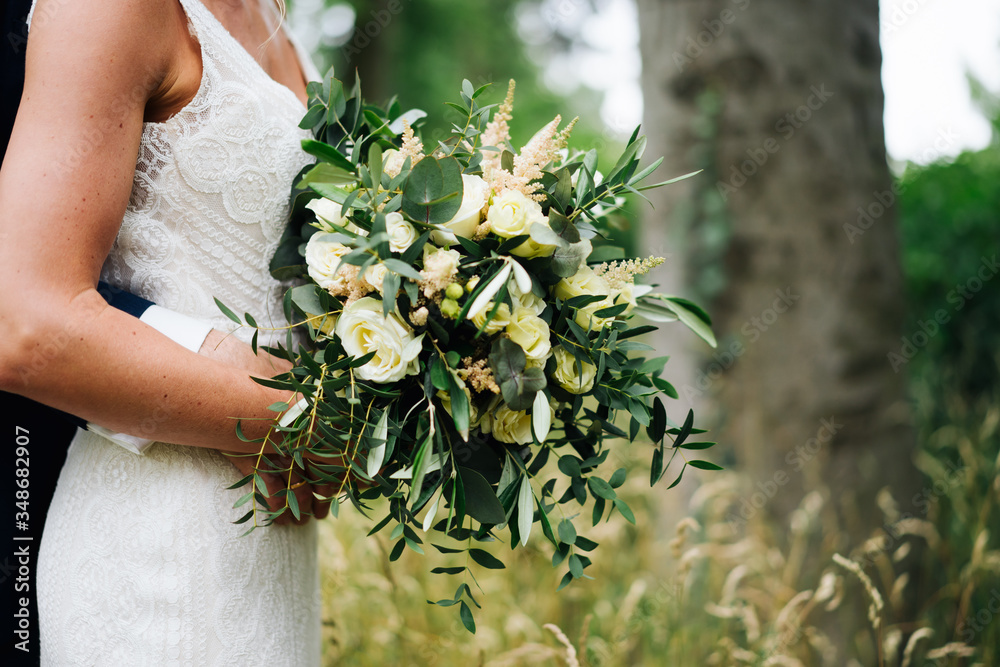 Sticker photo of a wedded couple standing in a forest