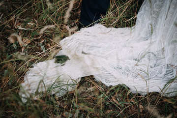 photo of a bride's dress in the forest