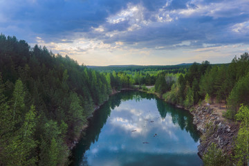 Mountain lake surrounded by forest. Spring landscape.