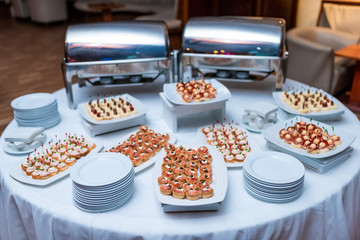 Banquet appetizers food catering on the dishes in buffet