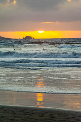 Surfing at Cicer Beach at sunset, Las Palmas de Gran Canaria