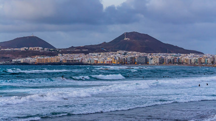 Surfing at Cicer Beach at sunset, Las Palmas de Gran Canaria