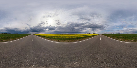 full seamless spherical hdr panorama 360 degrees angle view on asphalt road among fields in evening...