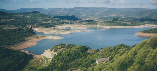 Panorama of Lago del Temo on Sardinia, close to the city of Monteleone Rocca Doria on a cloudy but sunny day.