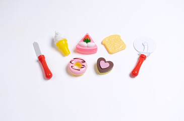 Obraz premium Collection of food toys for kids. Ice cream, slice of cake, donuts. Flay lay image. White background