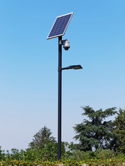 Street lighting pole with photovoltaic panel and surveillance camera