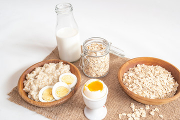 ready-made oatmeal porridge, healthy Breakfast with boiled egg