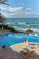 Fototapeta na wymiar View of the pool and the Mediterranean Sea - Italy