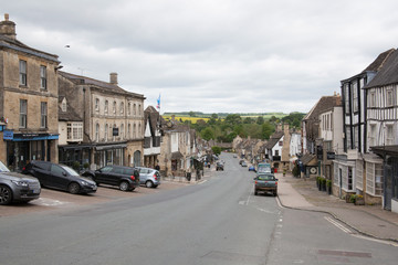 Shops and hotels on the High Street in Burford in Oxfordshire, UK