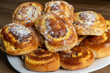 Patties with cottage cheese and raisins piled up on a plate.