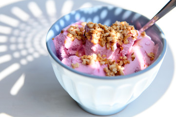 Strawberry ice cream with nuts. The taste of summer.